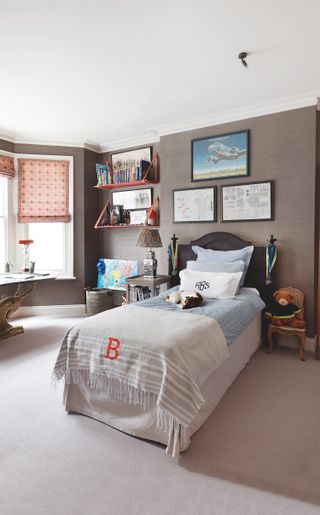 boy bedroom with single bed and gallery wall