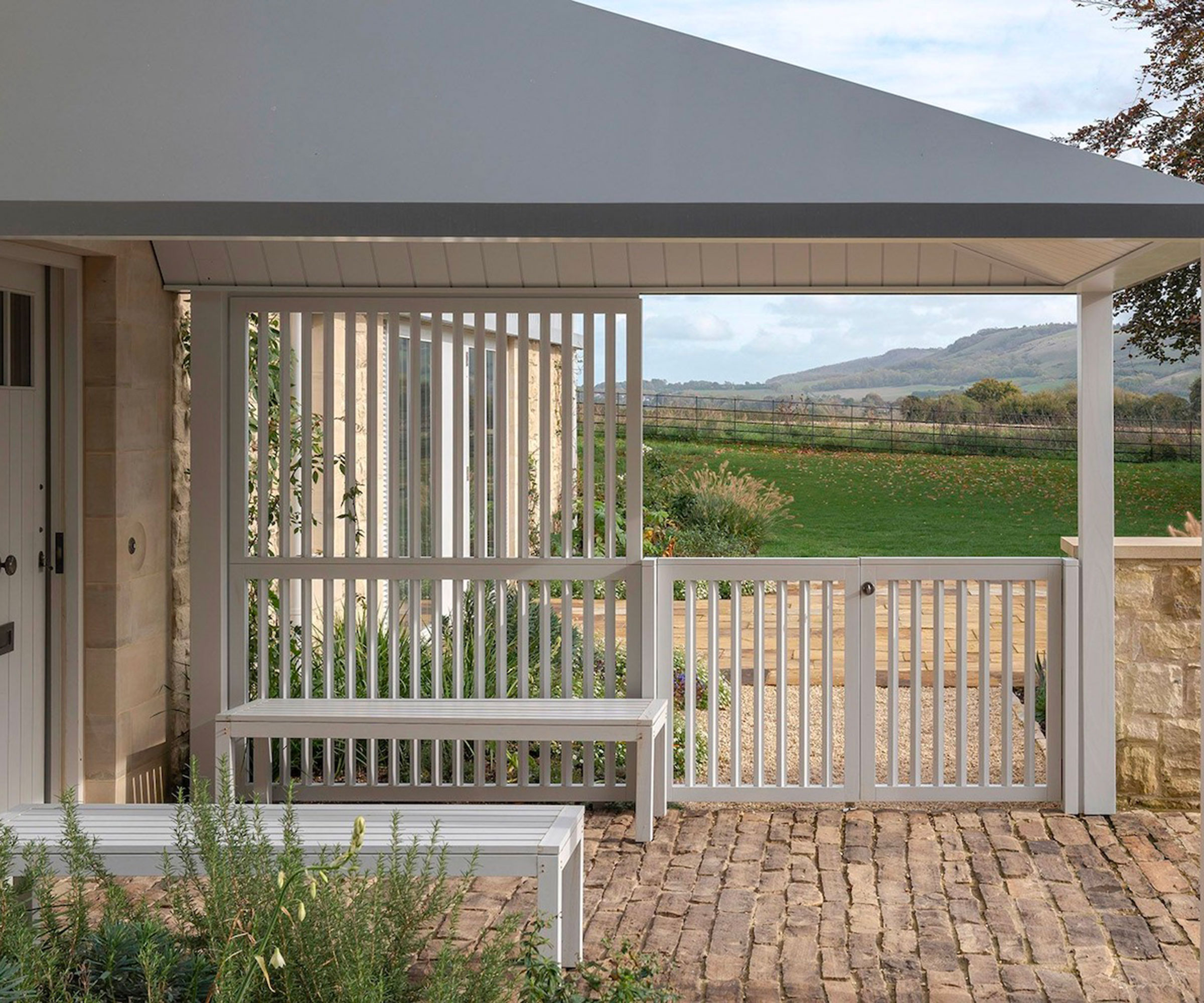 large open white porch with seating