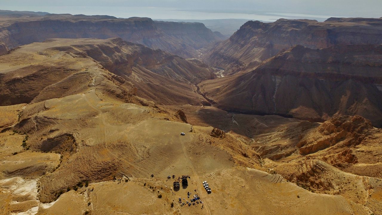Here, an aerial view of the Judean Desert caves where archaeologists made several discoveries, including that of a biblical scroll.