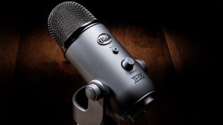 A THX-certified Blue Yeti podcast mic on a dark background