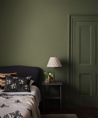green bedroom with doors painted the same as walls by Paint & Paper Library