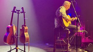 Tommy Emmanuel performs. The photo shows him playing one of the three Maton acoustics he performs with.