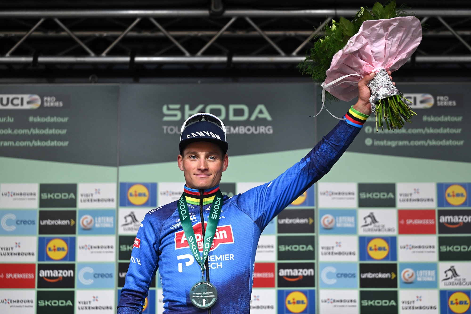 Mathieu van der Poel celebrates on the podium as the stage 1 winner of the Tour de Luxembourg