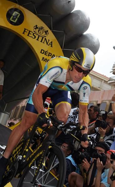 Lance Armstrong powers out of the start house.