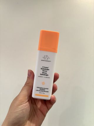 Mica Ricketts holding Drunk Elephant C-Luma Hydrabright Serum