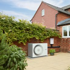 Worcester Bosch heat pump on terrace outside house