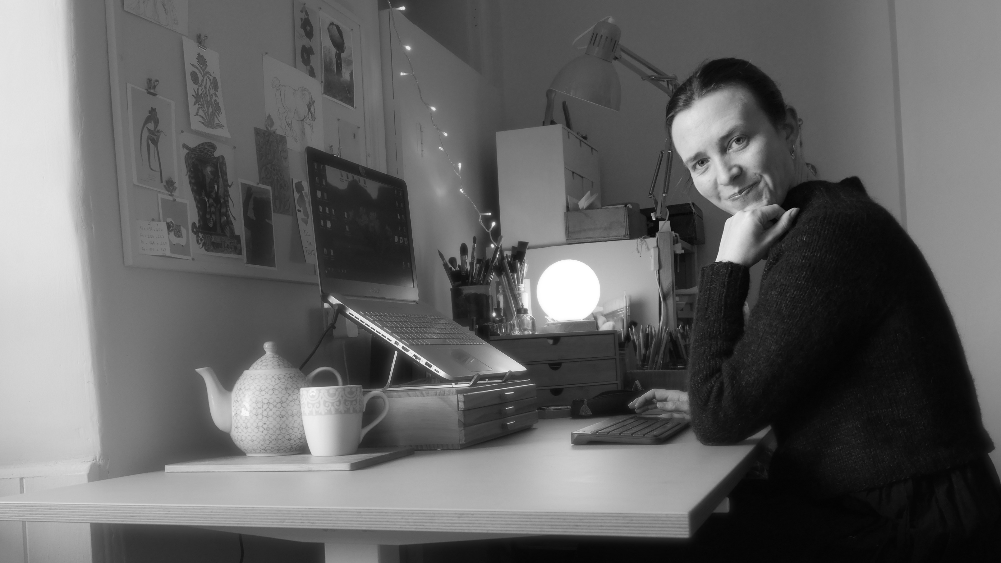Artist in residence; A woman sits at a desk