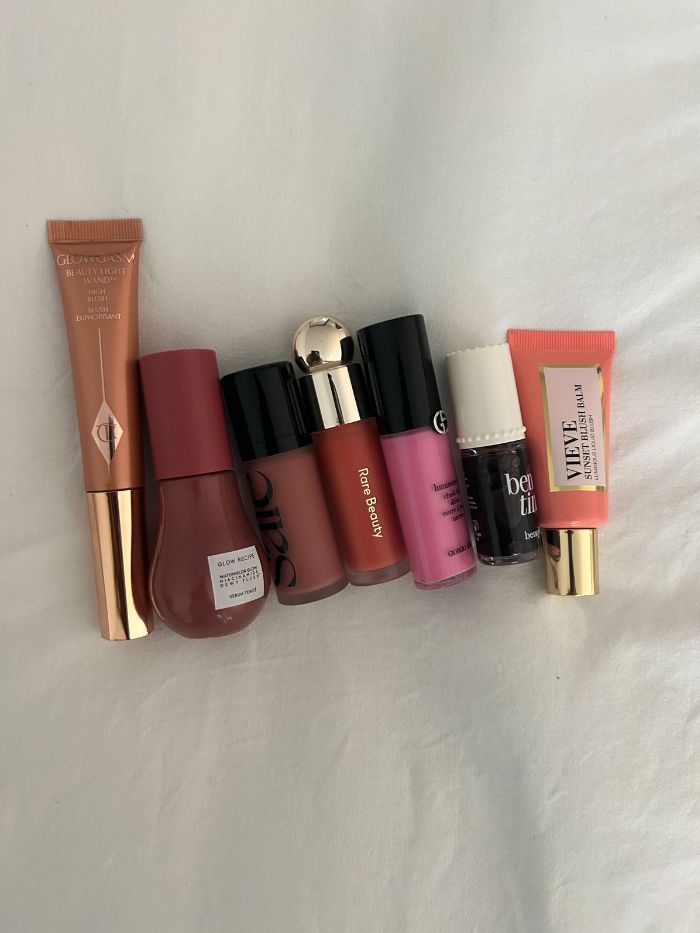 A selection of liquid blushers on a white sheet