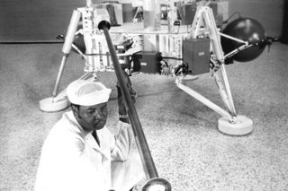 A technician checks the soil sampler on the Viking Lander in 1971 before the probe traveled to Mars. Some scientists think that the organic molecules in the soil samples collected by the lander were burned up accidentally.