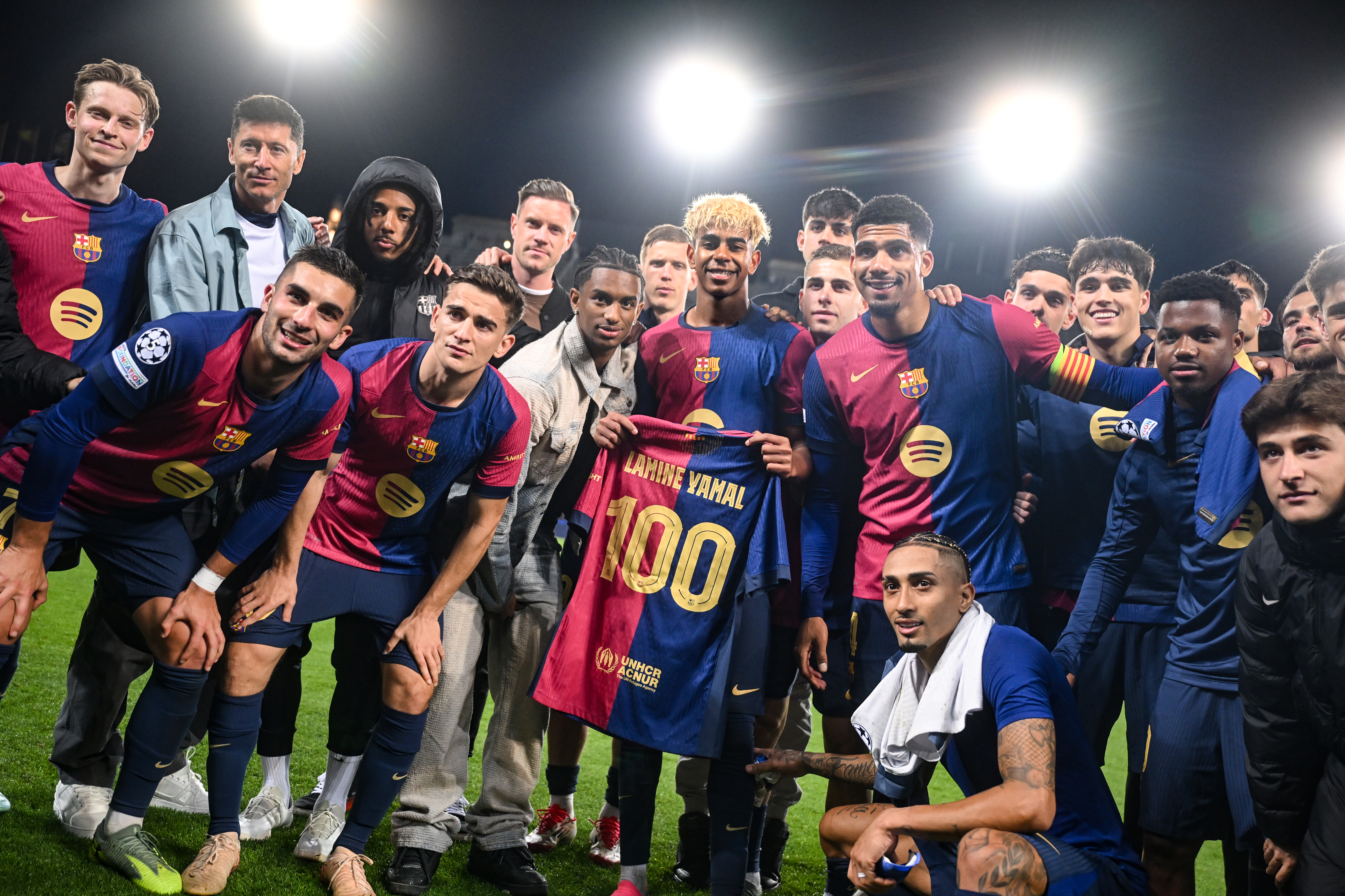 Lamine Yamal poses with a special shirt to mark his 100th Barcelona appearance after the team's Champions League semi-final first leg against Inter in April 2025.