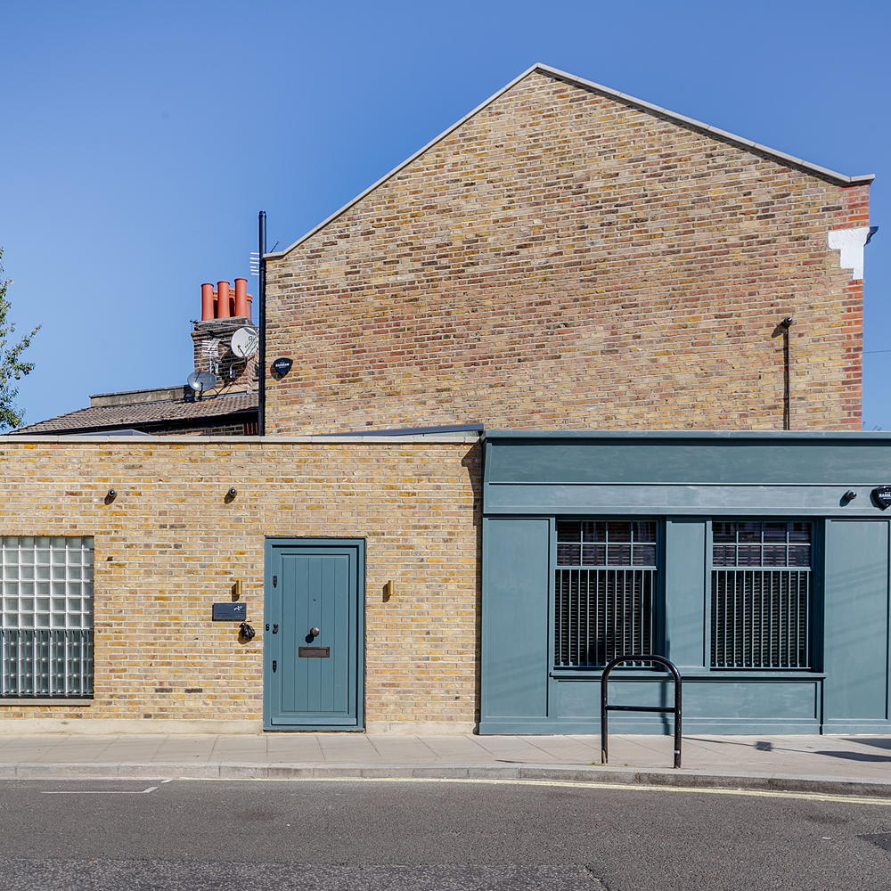house exterior brick wall blue door