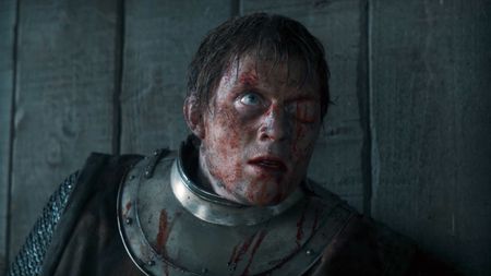 A severely injured Dunk looking at at someone off-camera in A Knight of the Seven Kingdoms episode 5