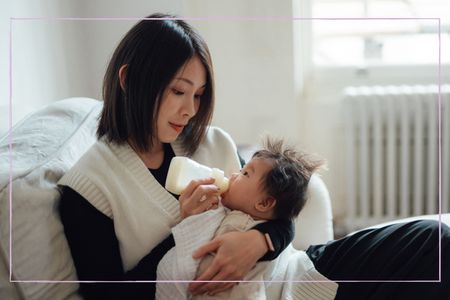 A woman bottlefeeding a newborn baby