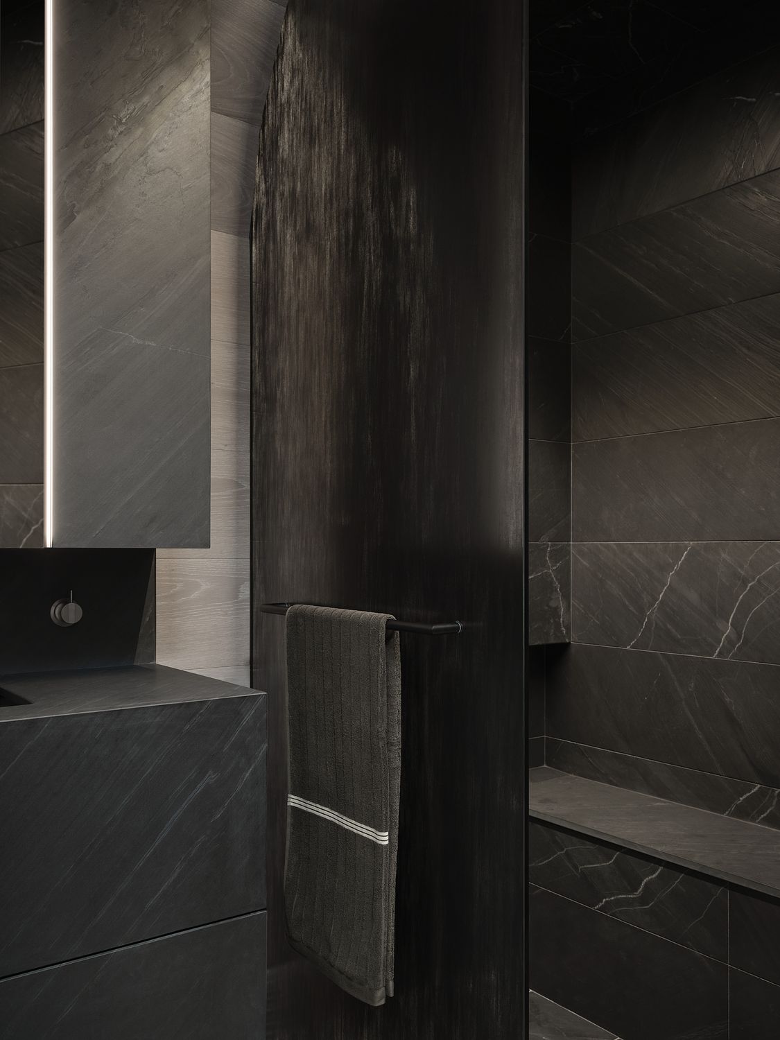 dark bathroom with black tiles, mirrored cabinet, shower seat