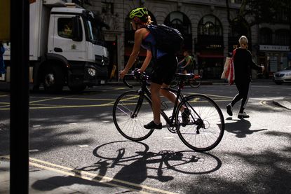 A cyclist negotiates London's streets