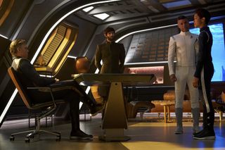 Pike (Anson Mount), Spock (Ethan Peck), Culber (Wilson Cruz) and Burnham discuss what to do about the Red Angel's warnings.