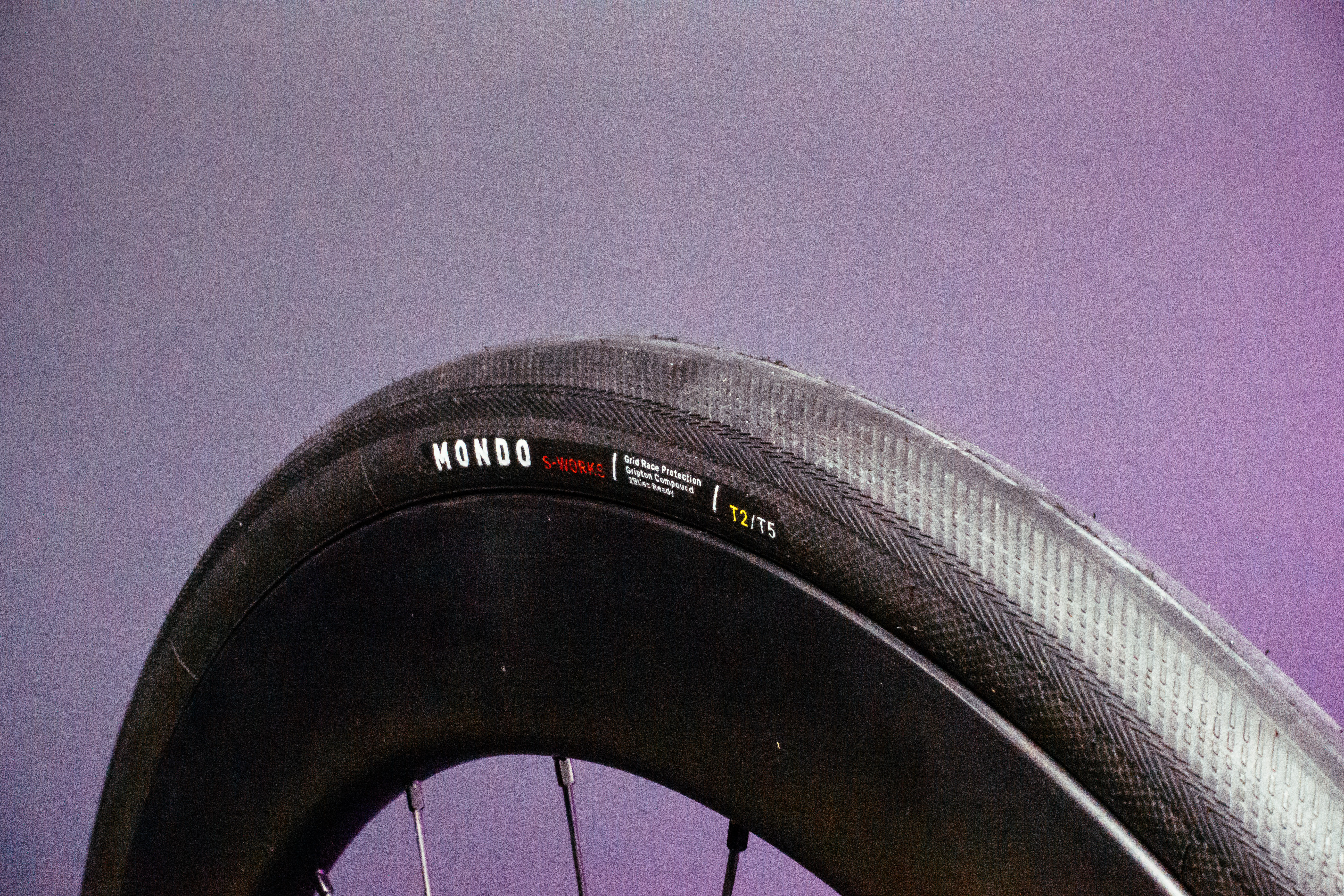 Specialized S-Works Mondo Road tyre with a purple background