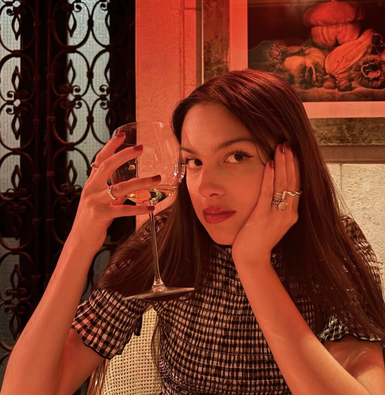Olivia Rodrigo posed in a seersucker gingham dress on Instagram in Sept. 2024
