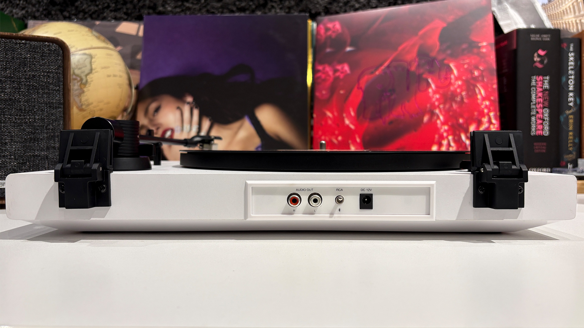 Rear connections show on the Mixx Analog+ turntable/CD player on white surface