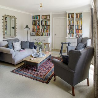 living room with sofa and book shelves