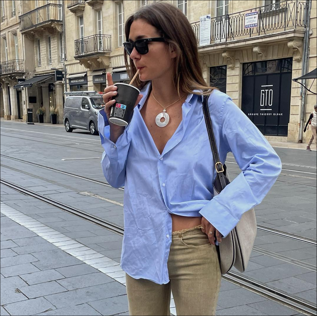 @ANNELAUREMAIS in Button down top drinking out of a straw 