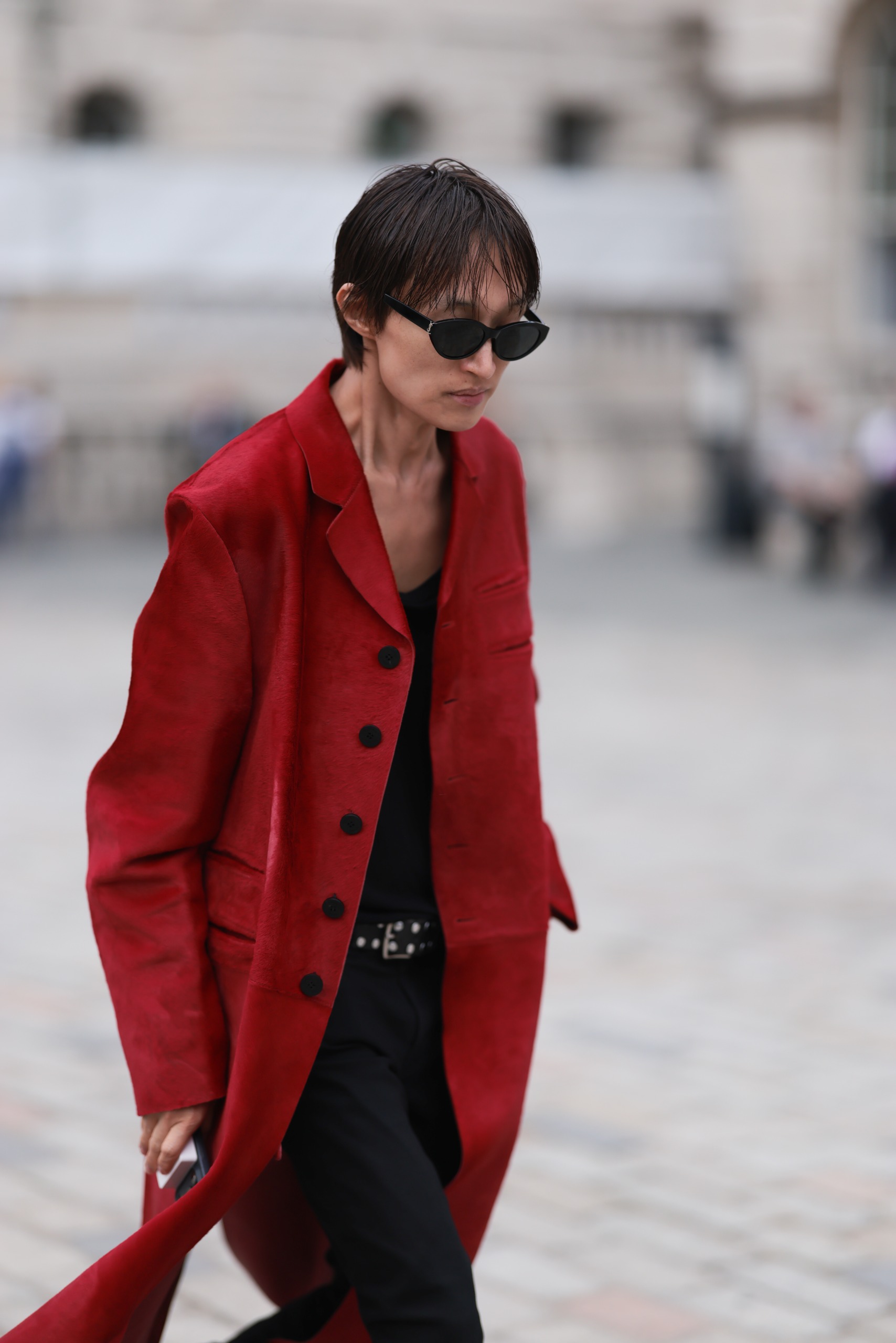 A guest wore a red coat similar to Zo&amp;euml; Kravitz's at London Fashion Week