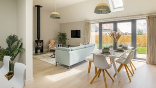 open plan living room diner with wooden flooring