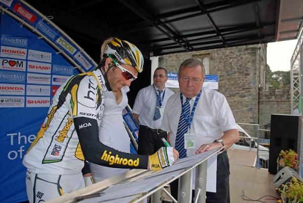 A smiling Michael Albasini (HTC - Columbia) signs on for stage five.