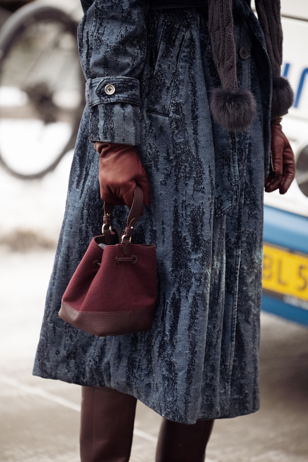 models at copenhagen fashion week wearing fur coats and colorful coats