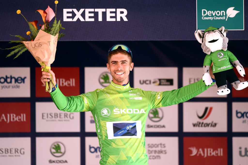 EXETER ENGLAND SEPTEMBER 06 Jacob Scott of United Kingdom and Team Canyon DHB Sungod celebrates winning the green mountain jersey on the podium ceremony after the 17th Tour of Britain 2021 Stage 2 a 1839km stage from Sherford to Exeter TourofBritain TourofBritain on September 06 2021 in Exeter England Photo by Harry TrumpGetty Images