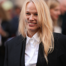 Pamela Anderson is seen outside The Row show wearing a white shirt and black blazer during the Womenswear Spring/Summer 2024 as part of Paris Fashion Week on September 27, 2023 in Paris, France