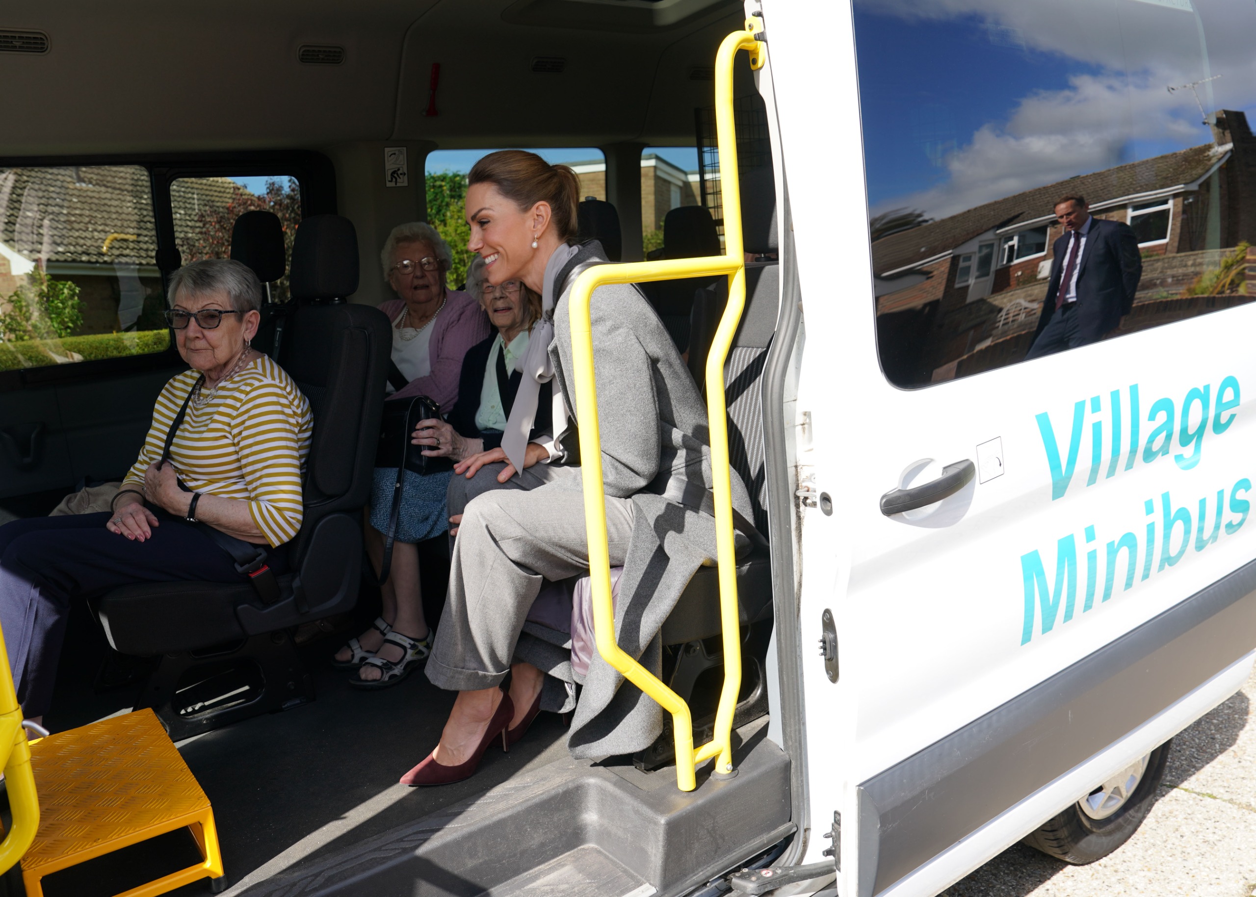 Princess Kate riding a minibus with senior citizens