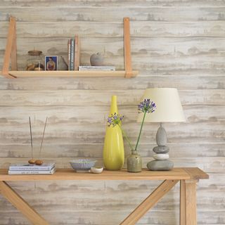 wooden shelf with leather brackets