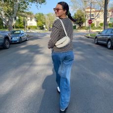Woman in striped shirt and jeans