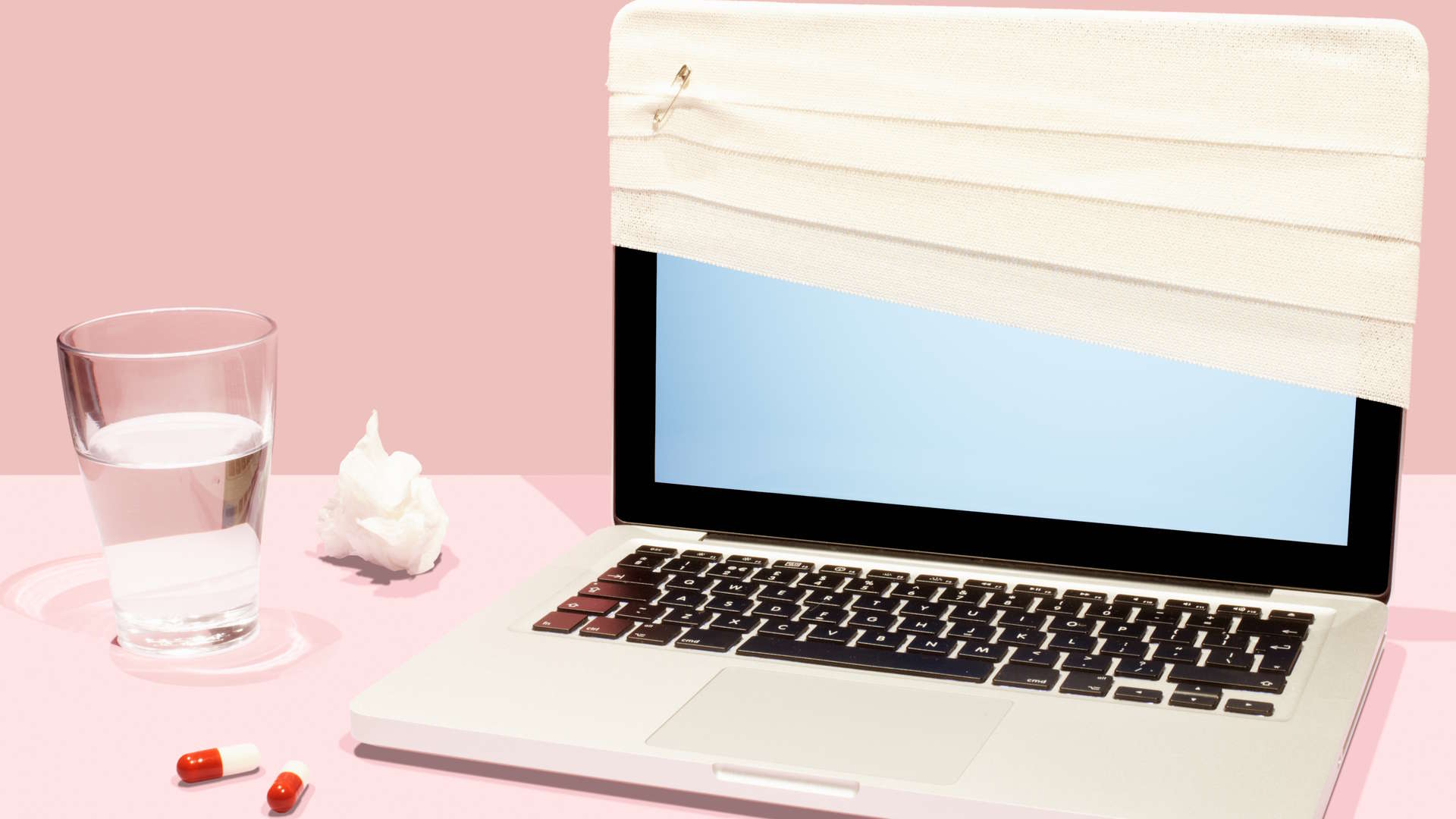 A Mac laptop with a bandage, implying faulty operation