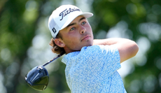 Trevor Gutschewski strikes a tee shot with a driver