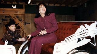 American singer Selena (born Selena Quintanilla-Perez, 1971 - 1995) rides in a carriage during a performance at the Houston Livestock Show & Rodeo at the Houston Astrodome, Houston, Texas, February 26, 1995. The performance was her last before her murder the following month.