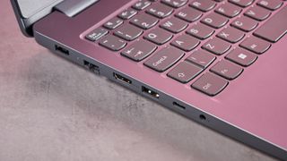 Close-up of left-side ports on Lenovo LOQ Essential Gen 9, open on desk