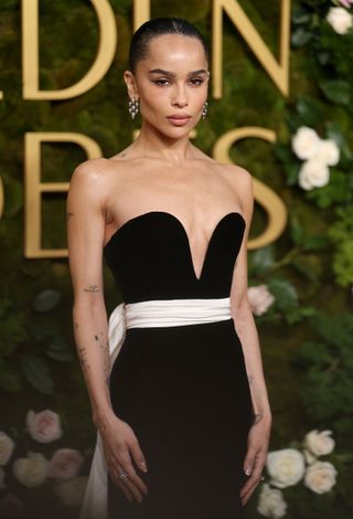 Zoë Kravitz attends the 82nd Annual Golden Globe Awards at The Beverly Hilton on January 05, 2025 in Beverly Hills, California wearing a black saint laurent dress