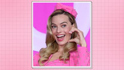 Margot Robbie pictured with pink french tip nails at the press conference for "Barbie" on July 03, 2023 in Seoul, South Korea