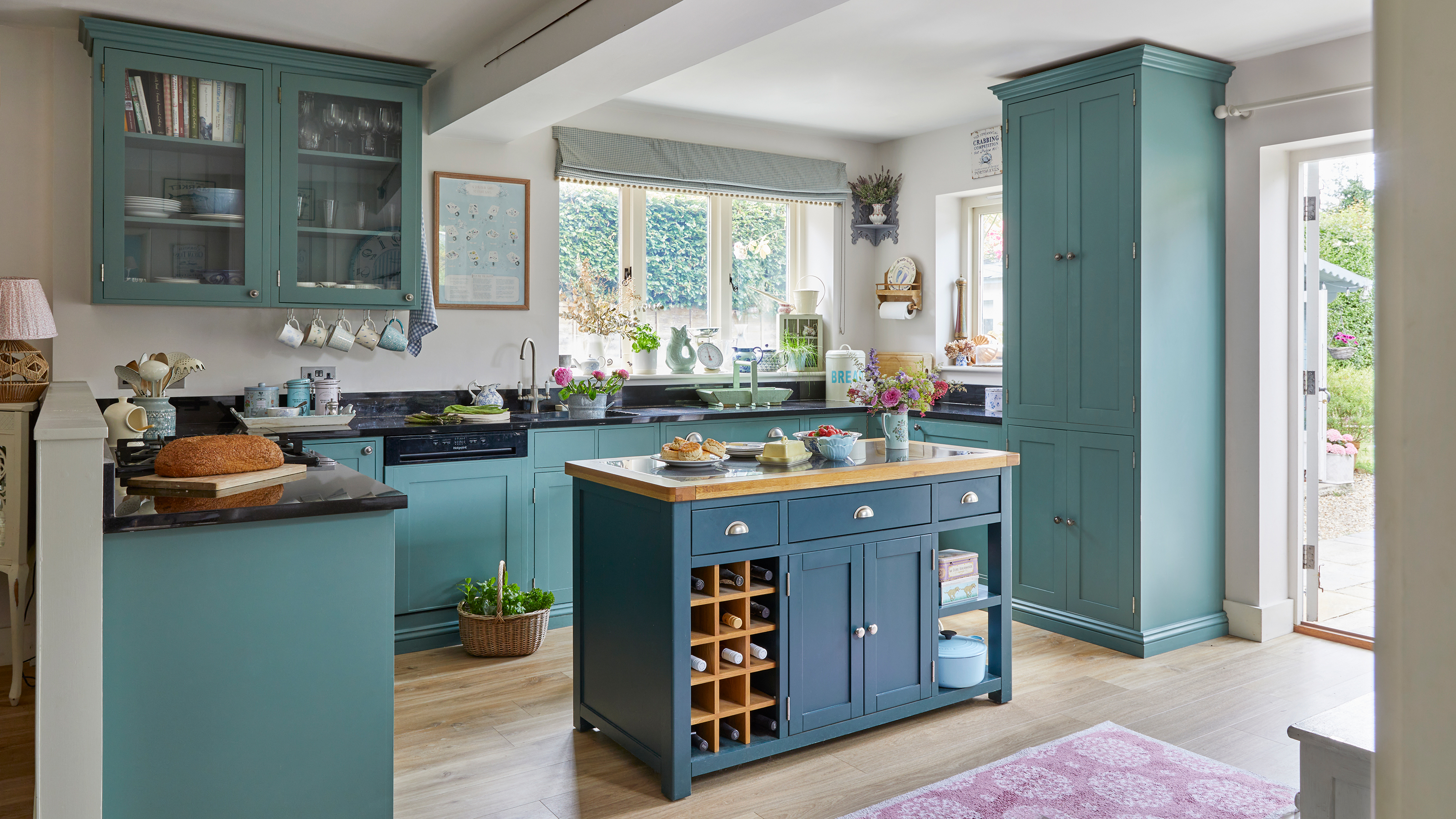 Teal painted country kitchen with freestanding island