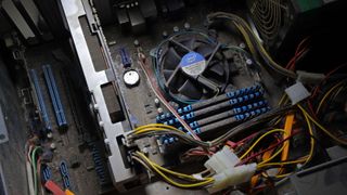 Inside an old gaming PC with lots of dust