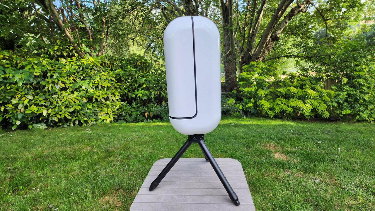 The Vaonis Vespera Pro in neutral position with grass and trees in the background.