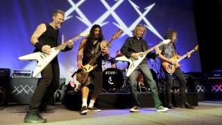 Metallica onstage with Brian Tatler