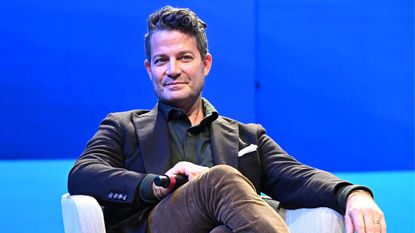 Nate berkus on a blue background