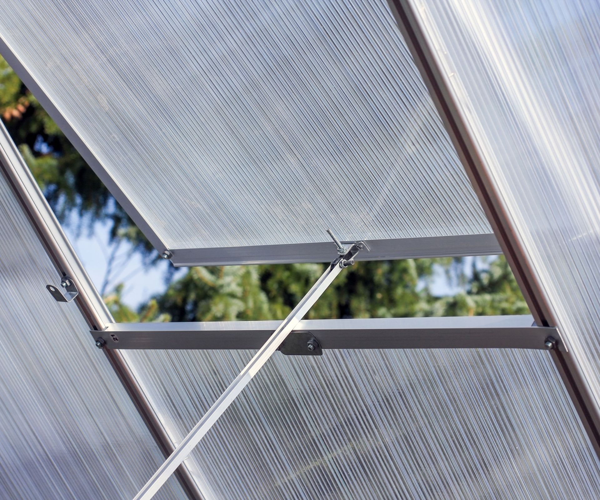partially open roof vent in greenhouse