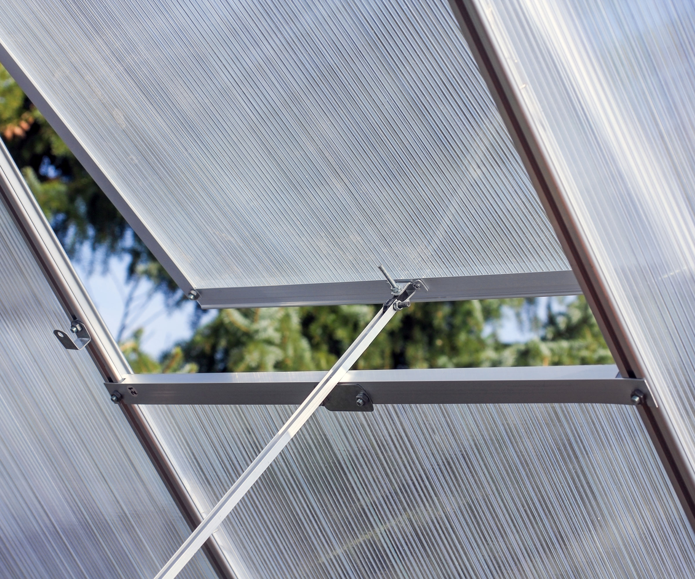 partially open roof vent in greenhouse