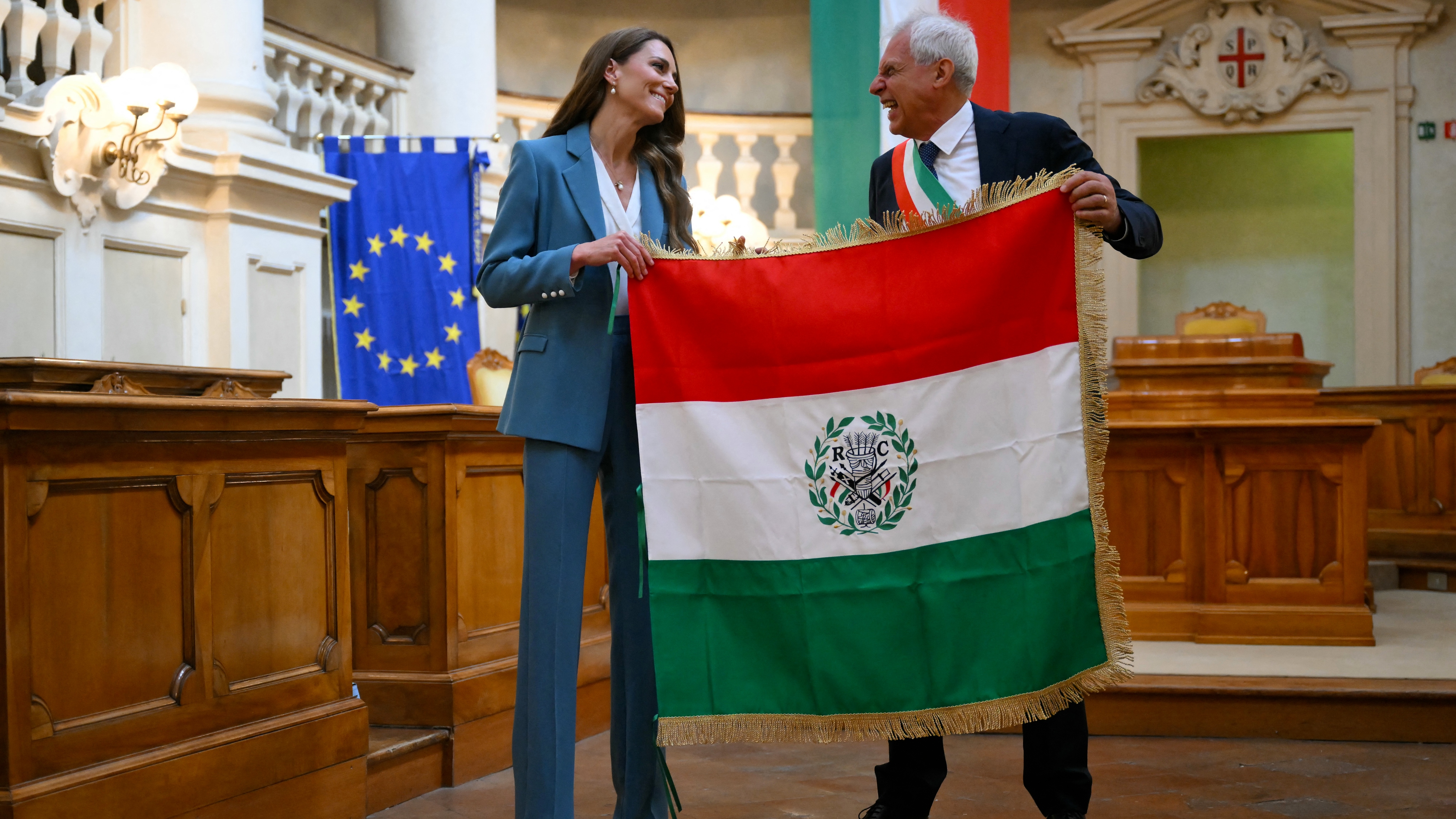Catherine, Princess of Wales is presented with the 'Primo Tricolore', the city's highest honour, in recognition of her early years work by the mayor of Reggio Emilia, Marco Massari