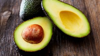 Avocado cut in half with stone on show