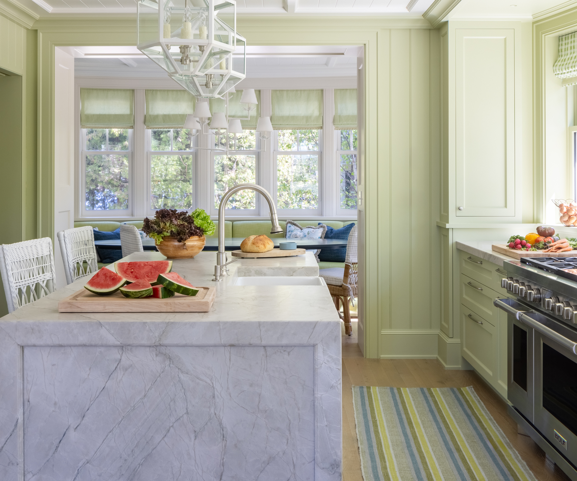 kitchen with green walls and marble island